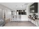 Bright kitchen featuring a breakfast bar with pendant lighting and modern gray floors at 757 Carson Ln, Greenfield, IN 46140