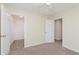 Bright bedroom with neutral walls and carpet featuring a walk-in closet for ample storage at 8248 Ossian Ct, Camby, IN 46113