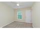 Bedroom showcasing soft carpet, bright windows, and a modern ceiling fan at 8248 Ossian Ct, Camby, IN 46113