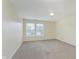 Comfortable carpeted bedroom featuring a ceiling fan and sun-filled windows at 8248 Ossian Ct, Camby, IN 46113
