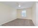Neutral bedroom with a ceiling fan and a view to the outside at 8248 Ossian Ct, Camby, IN 46113