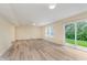 Bright bonus room features sliding doors to the yard, a ceiling fan, and neutral colored walls at 8248 Ossian Ct, Camby, IN 46113