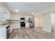 Bright kitchen with stainless steel appliances, granite countertops, and modern flooring at 8248 Ossian Ct, Camby, IN 46113
