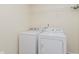 Bright laundry room featuring a new washer and dryer, plus wire shelving at 8248 Ossian Ct, Camby, IN 46113