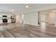 Open floor plan with combined kitchen and living area featuring modern appliances and a large window at 8248 Ossian Ct, Camby, IN 46113