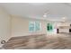 Open living area with lots of natural light, ceiling fan, and sliding glass doors to the backyard at 8248 Ossian Ct, Camby, IN 46113