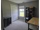 Bright bedroom with soft grey walls, plush carpeting, and a built-in storage unit at 8460 Ferguson Cir, Avon, IN 46123