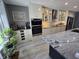 Modern kitchen with stainless steel appliances, custom cabinets and granite countertops at 8460 Ferguson Cir, Avon, IN 46123
