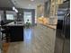 A modern kitchen with updated cabinets, granite countertops, and stainless steel appliances at 8460 Ferguson Cir, Avon, IN 46123