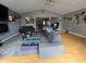 Spacious living room with vaulted ceilings, fireplace, and hardwood flooring throughout at 8460 Ferguson Cir, Avon, IN 46123
