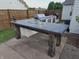 Outdoor kitchen with concrete countertop and gas grill is perfect for entertaining in the backyard at 8460 Ferguson Cir, Avon, IN 46123