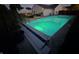 A refreshing pool with its cover partially retracted, nestled in a well-manicured backyard at 8460 Ferguson Cir, Avon, IN 46123
