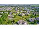 A picturesque neighborhood with well-maintained lawns, winding streets, and a serene pond at 8557 Vyners Ln, Avon, IN 46123