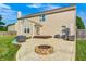 The backyard has a concrete patio with lounge seating, a fire pit, and a manicured lawn at 8557 Vyners Ln, Avon, IN 46123