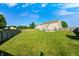 The expansive backyard features a well-manicured lawn and a fenced perimeter, perfect for outdoor activities and privacy at 8557 Vyners Ln, Avon, IN 46123