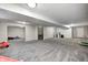 Spacious finished basement with gray carpet, neutral walls, and ample room for recreation at 8557 Vyners Ln, Avon, IN 46123