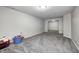 Finished basement with light gray carpet and neutral walls at 8557 Vyners Ln, Avon, IN 46123