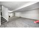 Expansive basement area with plush gray carpet and light gray walls at 8557 Vyners Ln, Avon, IN 46123