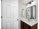 Bathroom features a dark wood vanity with marble top and modern lighting at 8557 Vyners Ln, Avon, IN 46123
