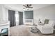 Comfortable Bedroom featuring a crib, comfy chair, carpeted floor, and large window at 8557 Vyners Ln, Avon, IN 46123