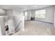 Neutral-toned bonus room features an abundance of natural light from large windows, gray walls, and carpet at 8557 Vyners Ln, Avon, IN 46123