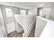 Inviting foyer with wood floors and stairway leading to the upstairs landing with large windows at 8557 Vyners Ln, Avon, IN 46123