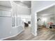 Bright foyer with staircase leading to upper level and views of the living room at 8557 Vyners Ln, Avon, IN 46123