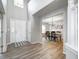 Spacious foyer featuring hardwood floors and a view into the dining area at 8557 Vyners Ln, Avon, IN 46123