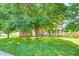 Charming home featuring a well-manicured lawn and mature trees that provide ample shade at 8557 Vyners Ln, Avon, IN 46123