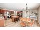 Large kitchen with stainless appliances, central island with seating, and a breakfast nook at 8557 Vyners Ln, Avon, IN 46123