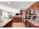 Stylish kitchen with stainless steel appliances, granite countertops, and open design at 8557 Vyners Ln, Avon, IN 46123