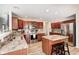 Modern kitchen features granite counters, stainless appliances, and ample cabinet space at 8557 Vyners Ln, Avon, IN 46123