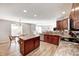 Charming kitchen featuring stainless appliances, granite counters, and a central island at 8557 Vyners Ln, Avon, IN 46123