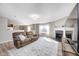 Open-concept living space with a fireplace and seamless flow to other rooms at 8557 Vyners Ln, Avon, IN 46123