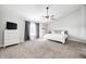 Light-filled main bedroom with a ceiling fan, soft carpet, and a serene, inviting atmosphere at 8557 Vyners Ln, Avon, IN 46123
