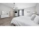 The spacious main bedroom features gray walls, neutral carpet, a ceiling fan, and natural light at 8557 Vyners Ln, Avon, IN 46123