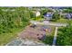 A well-maintained playground with play structures and a basketball court, located within the community at 8557 Vyners Ln, Avon, IN 46123