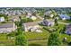 Aerial view of a home with a well-maintained backyard including a patio and fire pit for outdoor living at 8557 Vyners Ln, Avon, IN 46123