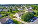 Aerial view of the backyard and house, surrounded by a vibrant neighborhood at 8557 Vyners Ln, Avon, IN 46123