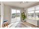 Bright sunroom with sliding doors to deck and a plant accent at 8557 Vyners Ln, Avon, IN 46123