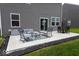 Backyard patio features an outdoor dining area and a separate lounge area with outdoor furniture at 9309 Kellner St, Pendleton, IN 46064