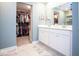 Bright bathroom boasts a double vanity, ample storage, and direct access to a spacious walk-in closet at 9309 Kellner St, Pendleton, IN 46064