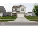 Attractive two-story home featuring a well-maintained lawn, neutral siding, and an attached two-car garage at 9309 Kellner St, Pendleton, IN 46064