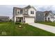 Beautiful two-story home boasts a well-manicured lawn, neutral siding, and an attached two-car garage at 9309 Kellner St, Pendleton, IN 46064