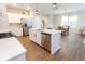 Modern kitchen features stainless appliances, white cabinets, a center island, and a dining area at 9309 Kellner St, Pendleton, IN 46064