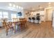 Open concept kitchen and dining area with wood floors and stainless steel appliances at 9309 Kellner St, Pendleton, IN 46064