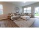 Inviting living room with a plush sectional, soft rug, and plenty of natural light at 9309 Kellner St, Pendleton, IN 46064