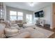 Comfortable living room features a large sectional, shiplap wall, and sliding door to backyard at 9309 Kellner St, Pendleton, IN 46064