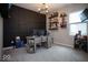Office with dark accent wall, shelves of trophies, and beverage center at 9309 Kellner St, Pendleton, IN 46064