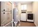 Well-equipped utility room with washer, dryer, water heater, furnace and built in storage at 9309 Kellner St, Pendleton, IN 46064